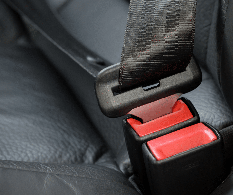 A securely buckled seat belt, representing the type of defective products Semenza Law sees in cases.